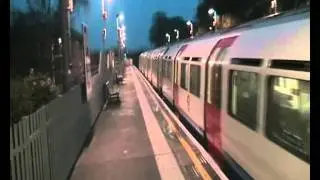 A northbound Piccadilly line train arrives at Alperton