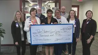 South Carolina woman, cancer survivor presents $1,000 donation to John Stoddard Cancer Center