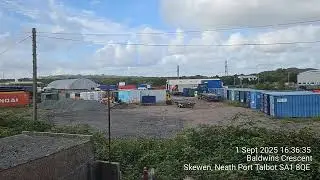01 September 2025 - Tractor Moving Storage Units on Site