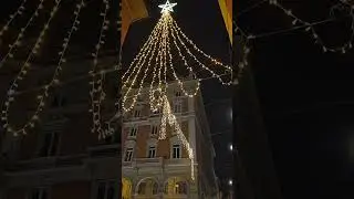 Evening Walk in Bologna Under Christmas Lights