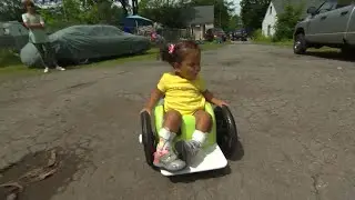 Homemade wheelchair gives toddler mobility for first time