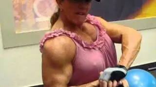 Female Bodybuilder doing  bicep cable curls with 55 lbs