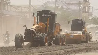 World Power Machines Moto grader and vibrating by roller to Building  National  Road