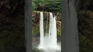 aerial view of waterfall of Kauai island in hawaii with DJI drone