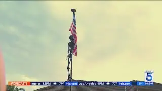 Skeleton decoration hanging from American flag raises concerns