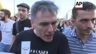 Greek finance minister joins colourful pride parade