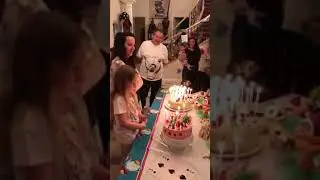 Girl catches hair on fire blowing out candles