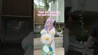 Cosplay handler holds everything