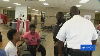 Uniformed police officers visit Normandy High School students for the first Brunch Patrol event