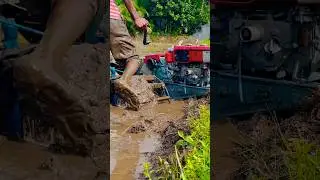 Kubota hand tractor stuck in the mud. #kubota  #farming #agriculture #tractor #shorts