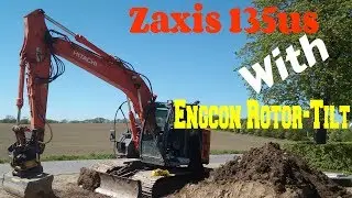 Grading Top soil out = Hitachi zaxis 135us 