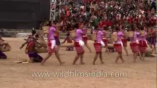 Garo tribal men playing drums while women dance to the beat!
