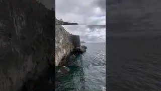 crazy man jumps off cliff