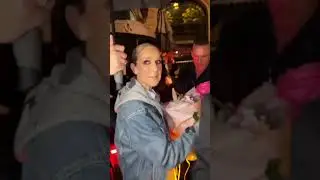 Celine Dion receives rose from a fan after Olympics Opening Ceremony performance