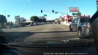 Instant Karma for car running red light, speeding and almost killing a cyclist - Los Angeles