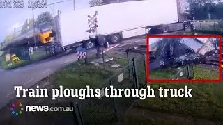 Truck driver reverses back into a level crossing with a train incoming