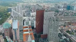 The Hague, Netherlands. Business center of The Hague. Large train station Den Haag Centraal. Clou...