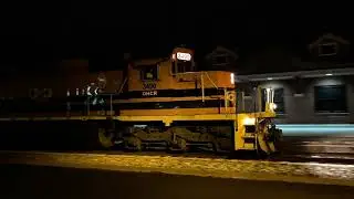A SD40-2 and Chuck are hauling an OC manifest train.