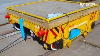 Automated material handling cart loads transport cart on rail
