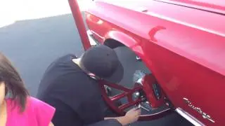 Walker auto Works putting a Mustang on her side at  Dr. George car show