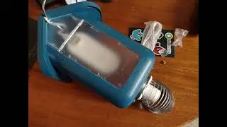 Installing a Bird Feeder on a galvanized pole with a slinky to thwart and deter squirrels
