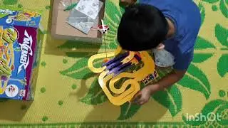 Rayyan plays with Rack Race.