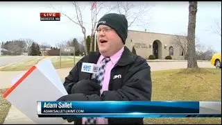 Bank robber runs by Rochester report during live shot