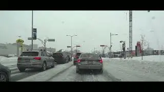 Driving in Chomedey, Laval under the snowing
