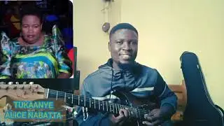 TUKAANYE ALICE NABATTA GUITARS BY TONNY LOVINGTON