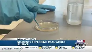 North Woolmarket Middle School students trade textbooks for test tubes