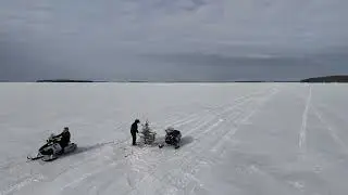 Snowmobilers cross international ice bridge connecting the U.S. and Canada
