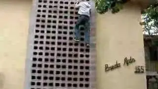 Jesse climbs a wall.
