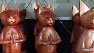 Handmade wooden Yoga Cat statues that we sell at the Crystal Shop Cyprus in Paphos