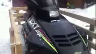 broken down arctic cat snowmobile