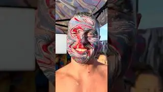Dipping his Face in Marbling Paint