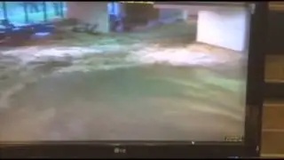 Raw: Flood Waters Crash Through College Campus