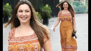 Kelly Brook looks radiant in orange floral dress in London