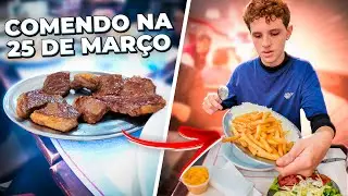 Comendo na rua 25 de Março em frente a mercado Municipal 