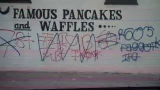 Crips and Bloods cross out each others gang Gang graffiti in the hood