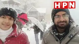 शिमला के रिज मैदान पर बर्फ के बीच मस्ती करते पर्यटक