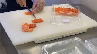 Chef removed the skin from the salmon and cut it into the desired shape - Salmon cutting skills 