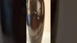 A Meiji period bronze vase by Yoshiharu