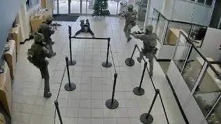 Surveillance video shows hostage standoff