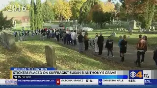 Voters place stickers on Susan B. Anthony's grave