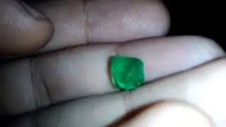 Reaction of flash light on authentic natural colombian emerald