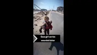 Gaza girl carries wounded sister