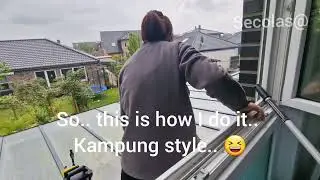 Glass roof cleaning using high-pressure cleaner.