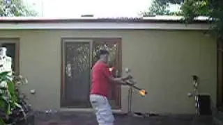 fishtail practice with one of my short staffs on fire during the daytime