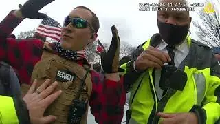 Officers Patting Down Man in 
