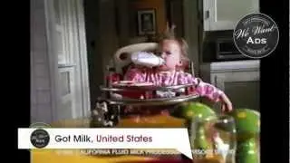 The baby wont let the cat take his milk